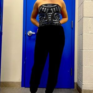 PARKER romper sleevless, evening, zipper back. Tapered ankle. Hip pockets Black